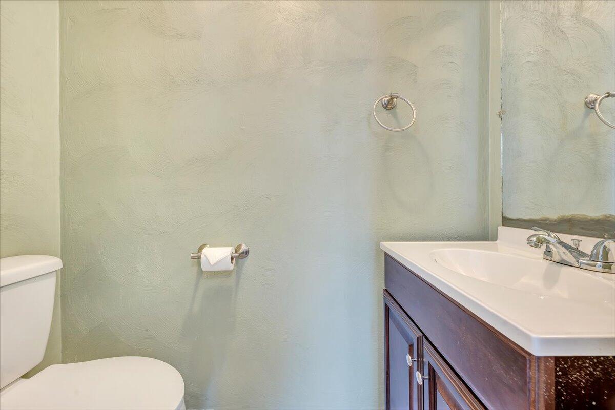1173 Sawmill Road Ferrum, VA 24088 - Photo 13 of 39 a bathroom with a sink a toilet and mirror