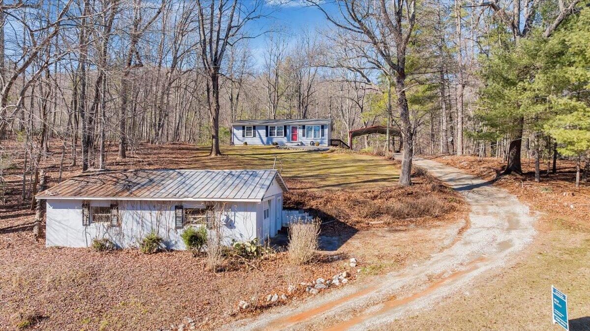 1173 Sawmill Road Ferrum, VA 24088 - Photo 28 of 39 a front view of a house with a yard covered with snow