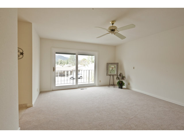 10146 Alpine Drive Cupertino, CA 95014 - Photo 10 of 15 a view of a livingroom with a ceiling fan and window