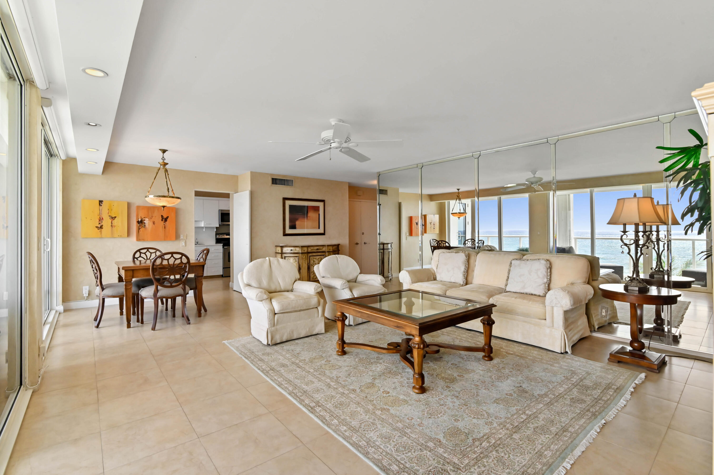 2800 South Ocean Boulevard, Unit 5J Boca Raton, FL 33432 - Photo 6 of 56 a living room with furniture and a table