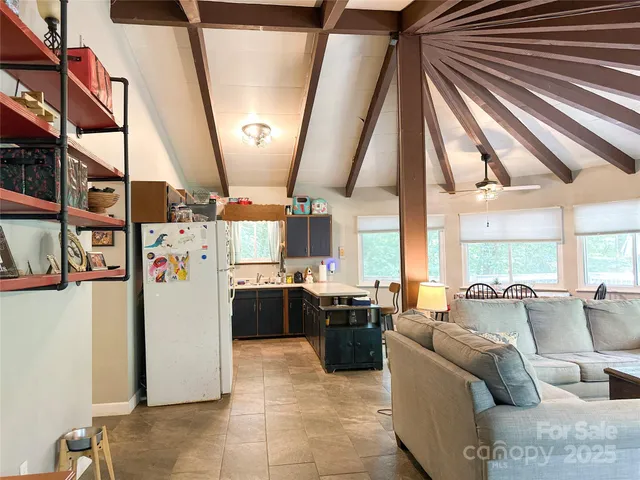 a living room with lots of furniture and a window