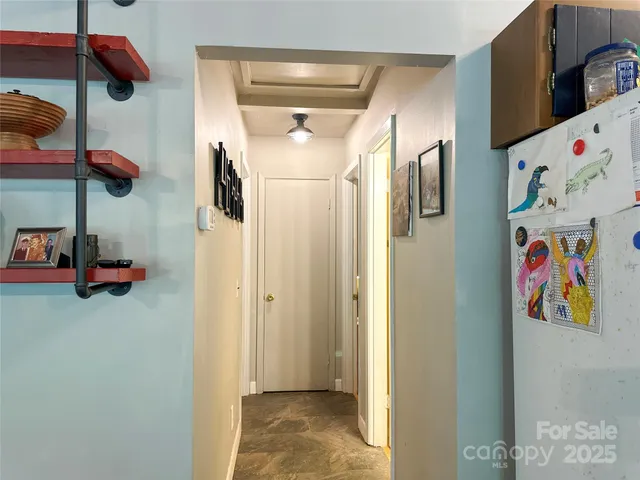 a view of a hallway with front door