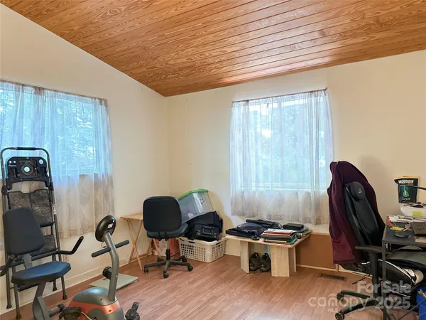 a livingroom with workspace and a window