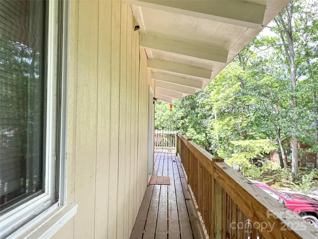 a view of balcony and wooden floor
