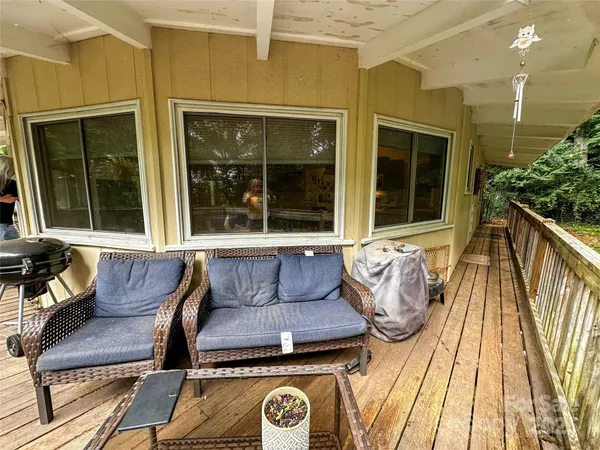 a wooden bench sitting in front of a building