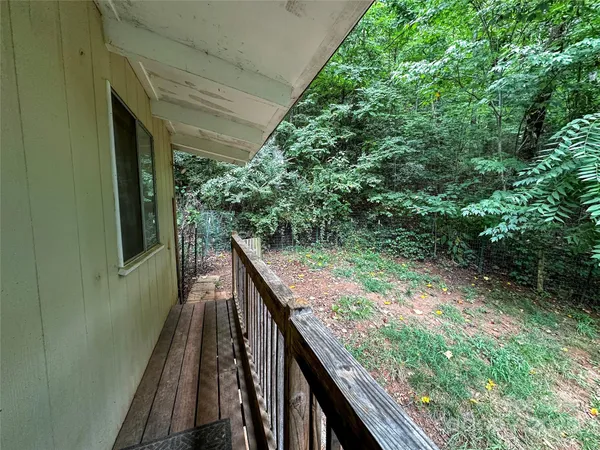 a view of balcony with wooden floor and outdoor space
