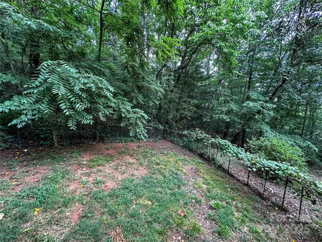 a view of backyard with patio
