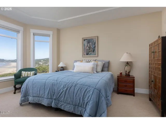 a view of a bathroom with tub shower and mirror