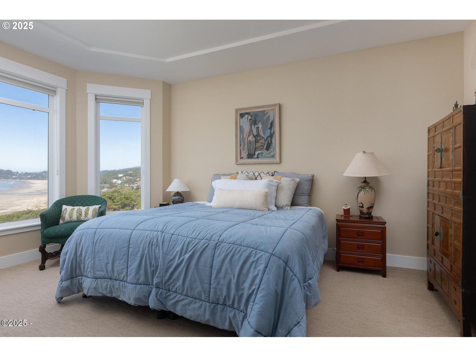 1125 Northwest Spring Street, Unit A302 Newport, OR 97365 - Photo 17 of 31 a bedroom with a bed and window