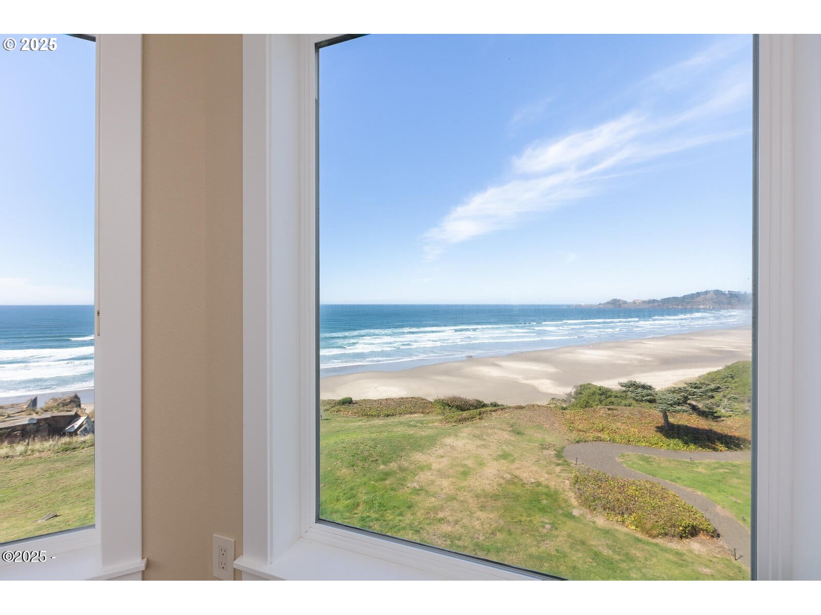 1125 Northwest Spring Street, Unit A302 Newport, OR 97365 - Photo 21 of 31 a view of an ocean from a balcony