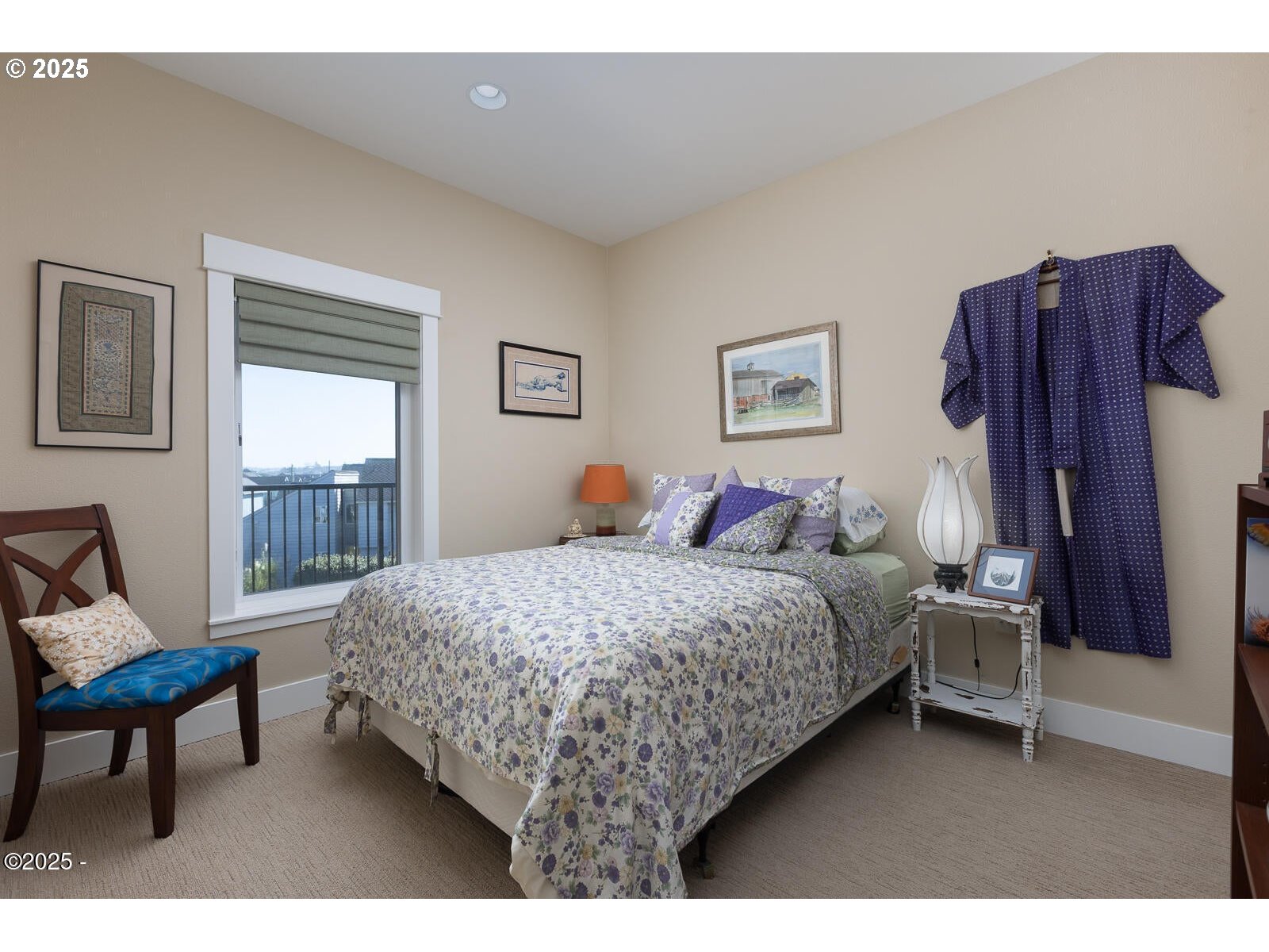 1125 Northwest Spring Street, Unit A302 Newport, OR 97365 - Photo 22 of 31 a bedroom with a bed chair and window