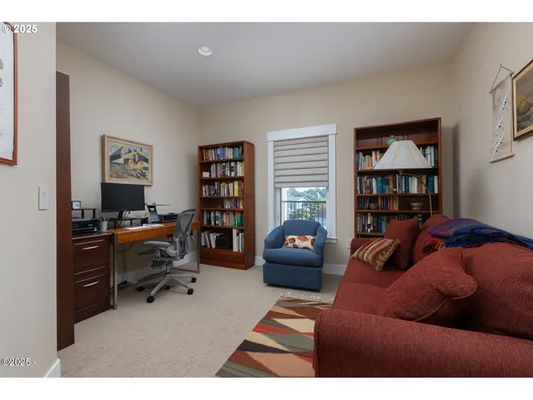 a bathroom with a granite countertop sink a mirror and shower