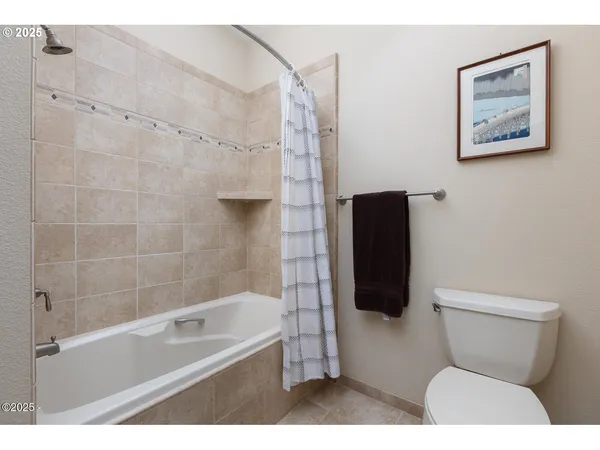 a view of a bedroom with washer and dryer