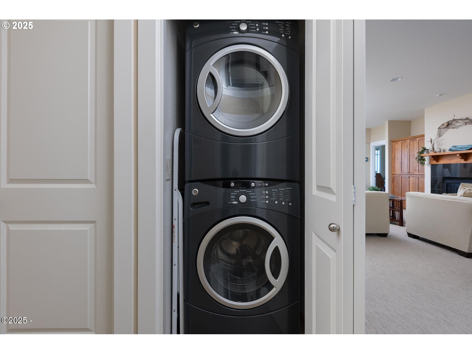 1125 Northwest Spring Street, Unit A302 Newport, OR 97365 - Photo 27 of 31 a view of a bedroom with washer and dryer