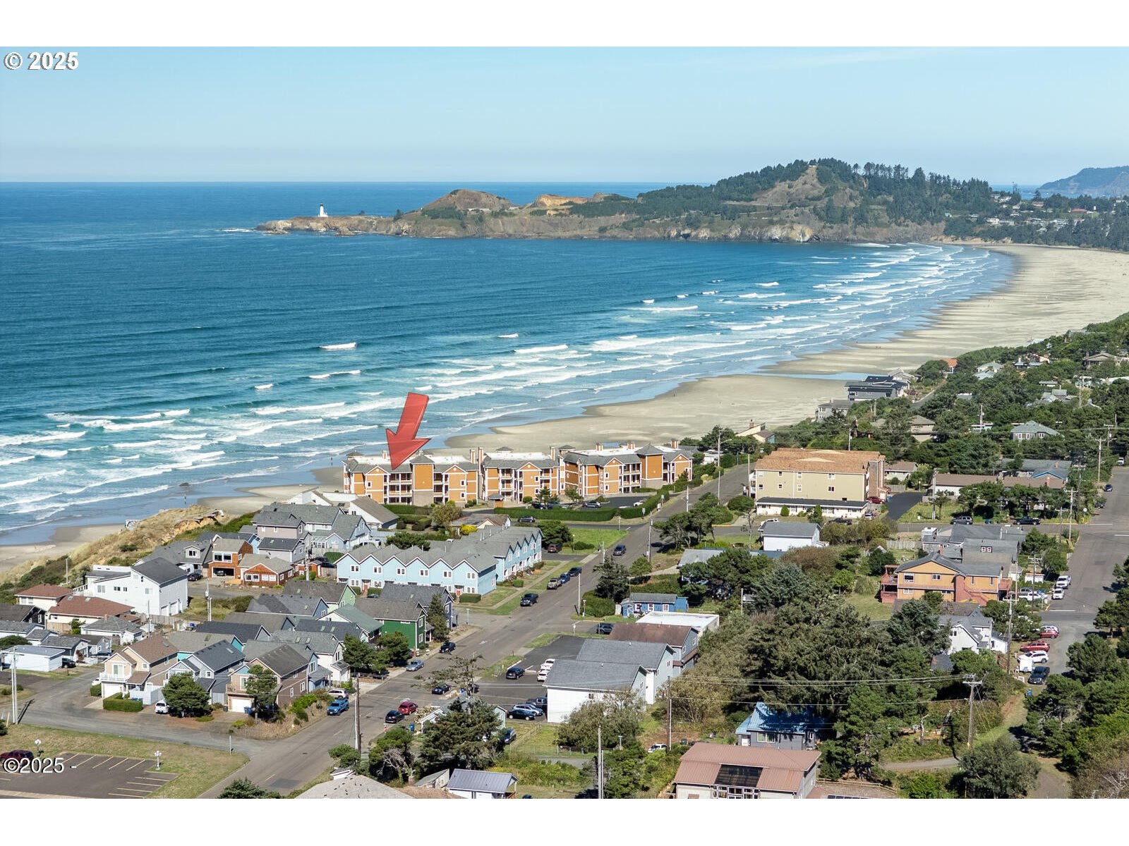 1125 Northwest Spring Street, Unit A302 Newport, OR 97365 - Photo 29 of 31 a view of a city with an ocean