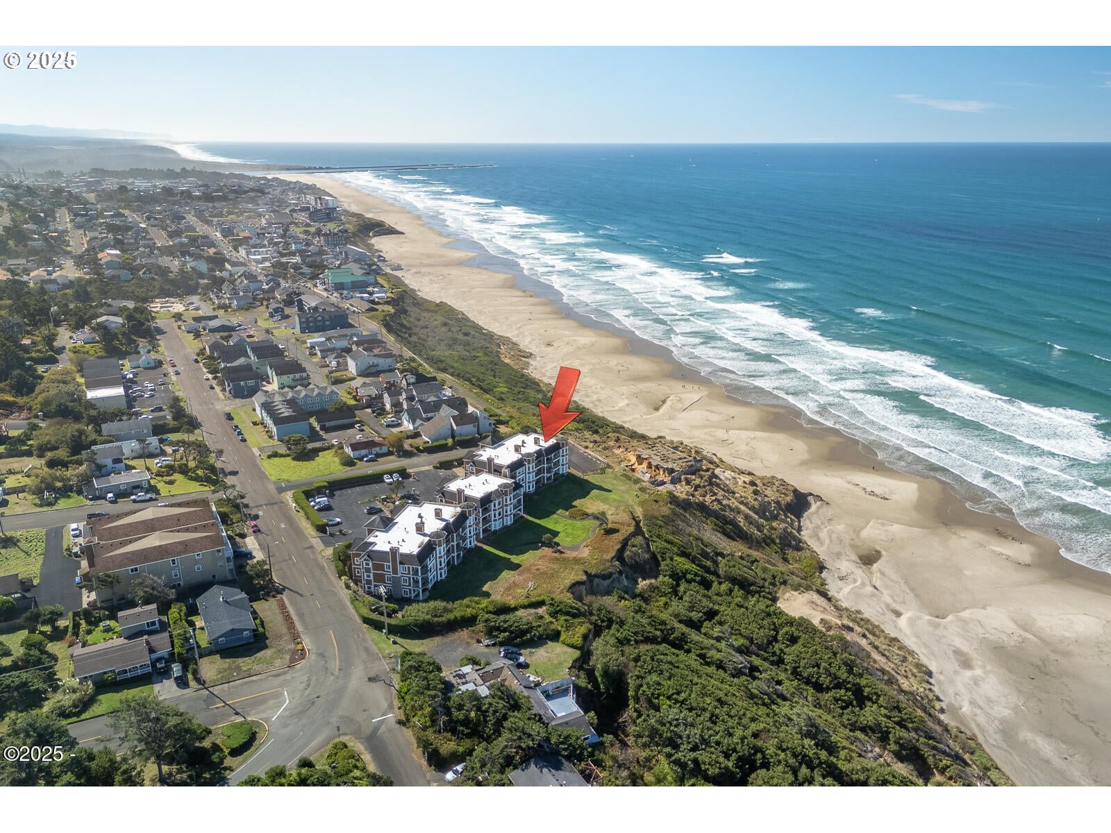 1125 Northwest Spring Street, Unit A302 Newport, OR 97365 - Photo 30 of 31 a view of an ocean beach