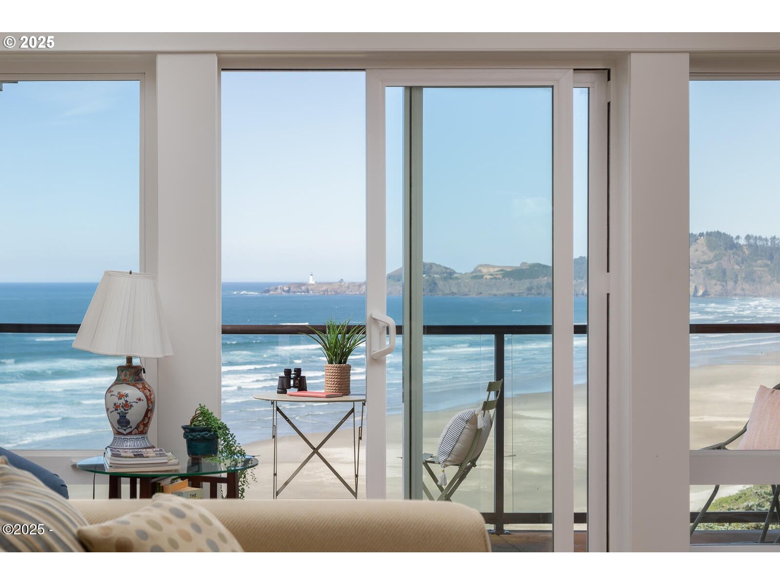 1125 Northwest Spring Street, Unit A302 Newport, OR 97365 - Photo 4 of 31 a view of living room with furniture and a floor to ceiling window