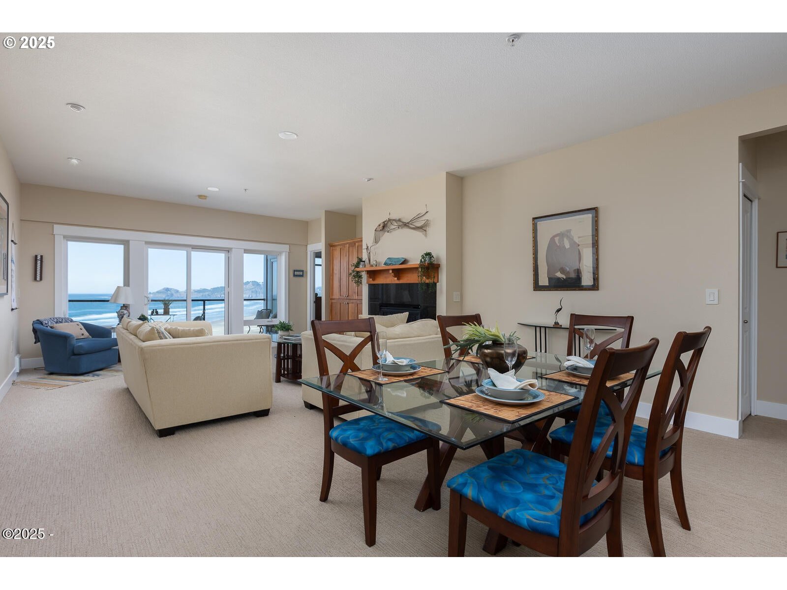 1125 Northwest Spring Street, Unit A302 Newport, OR 97365 - Photo 10 of 31 a dining room with furniture and wooden floor