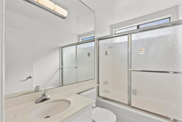 a bedroom with a bed and furniture