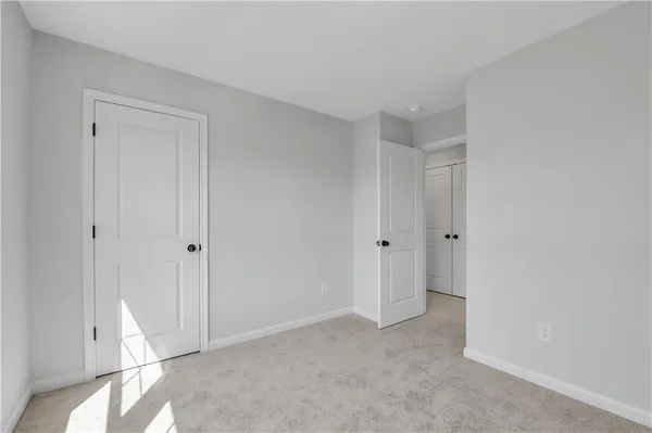 a view of room with window and entryway