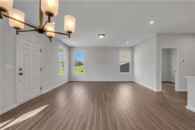 a kitchen with a sink appliances and cabinets