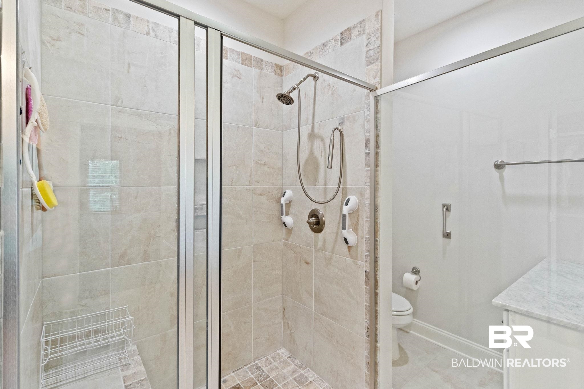 192 Mark Twain Loop Foley, AL 36535 - Photo 25 of 42 Bathroom featuring walk in shower, tile patterned flooring, toilet, and vanity