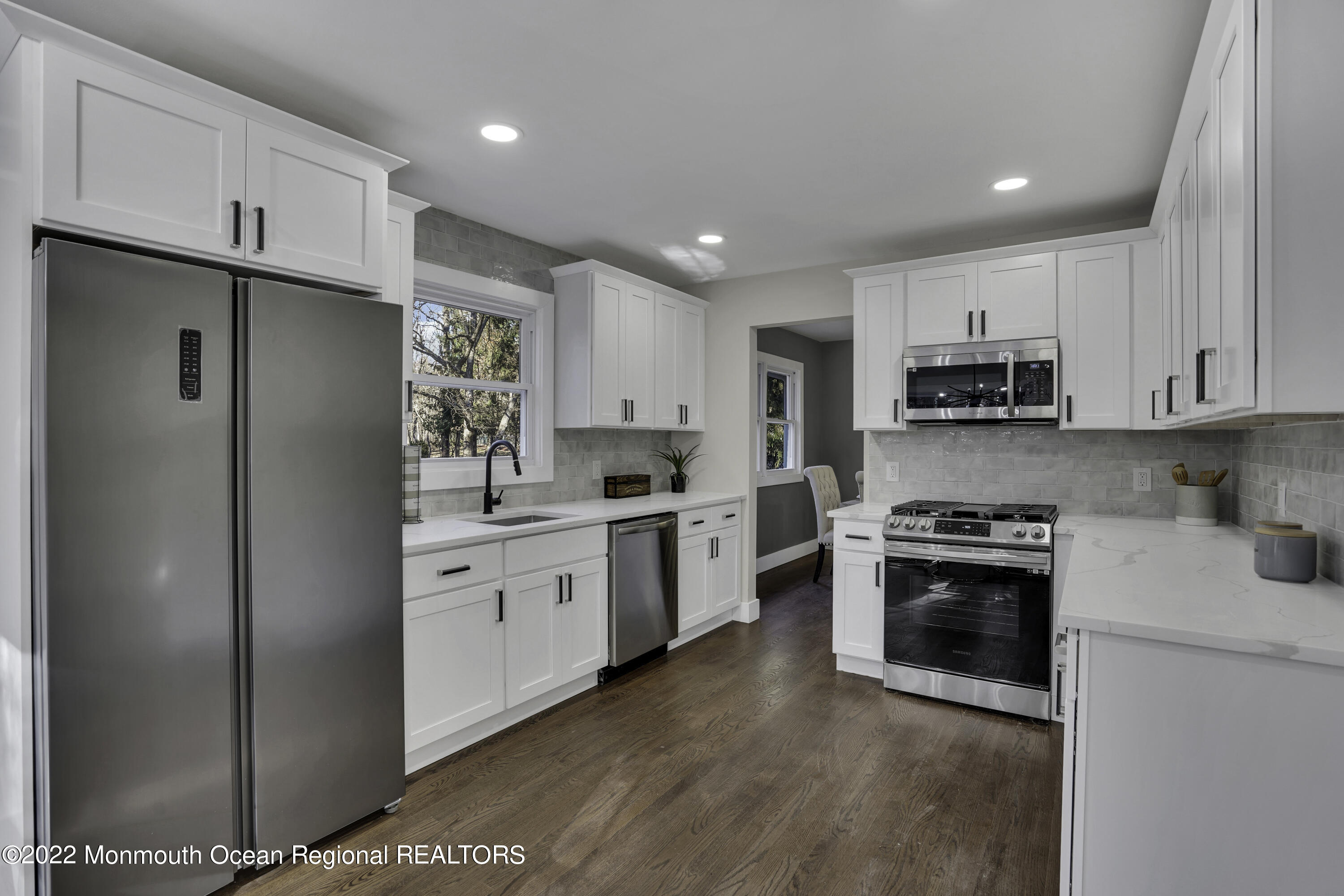 614 Jackson Mills Road Jackson, NJ 08527 - Photo 15 of 64 a kitchen with stainless steel appliances granite countertop a refrigerator sink and stove