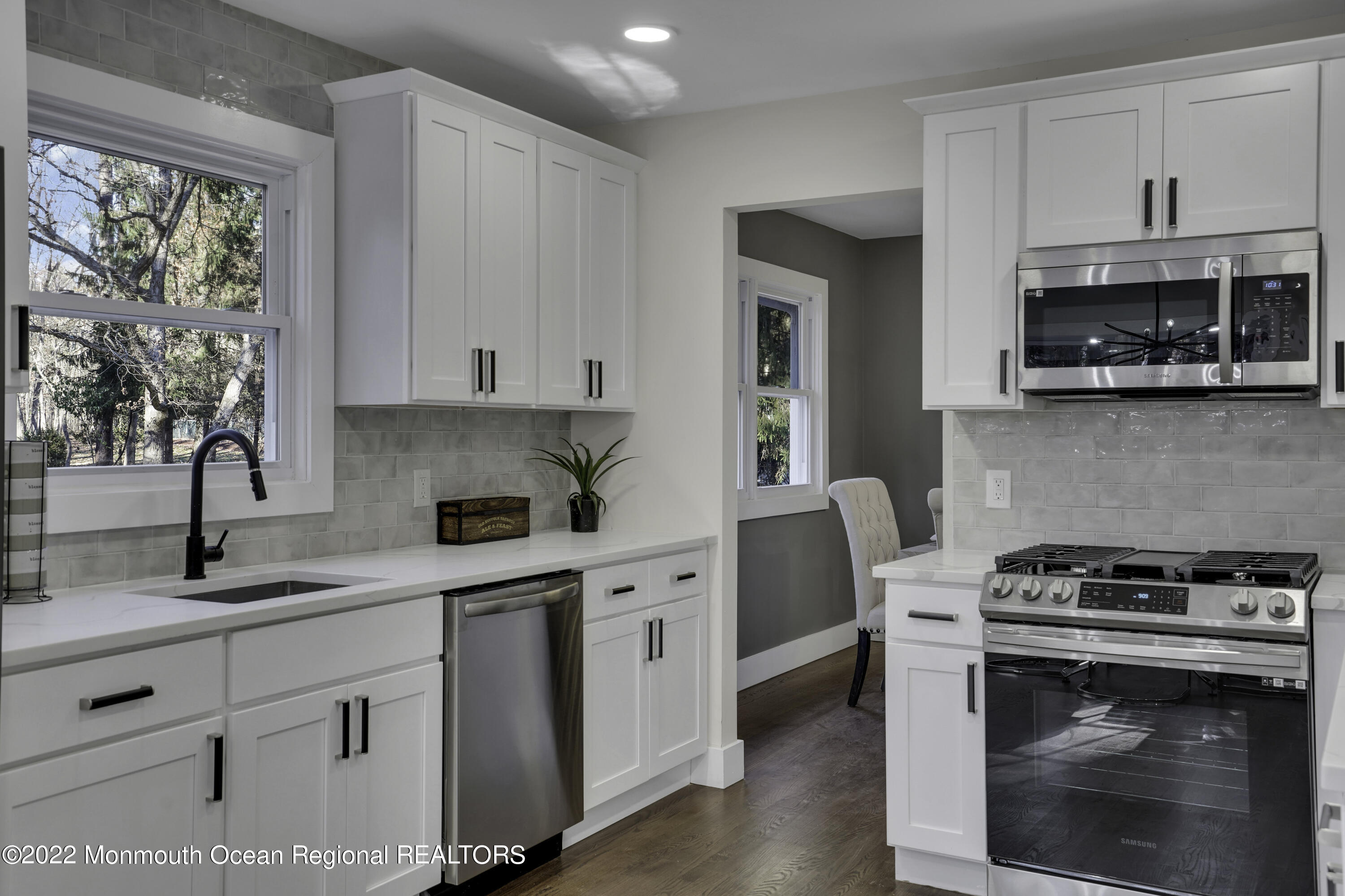 614 Jackson Mills Road Jackson, NJ 08527 - Photo 18 of 64 a kitchen with white cabinets and appliances