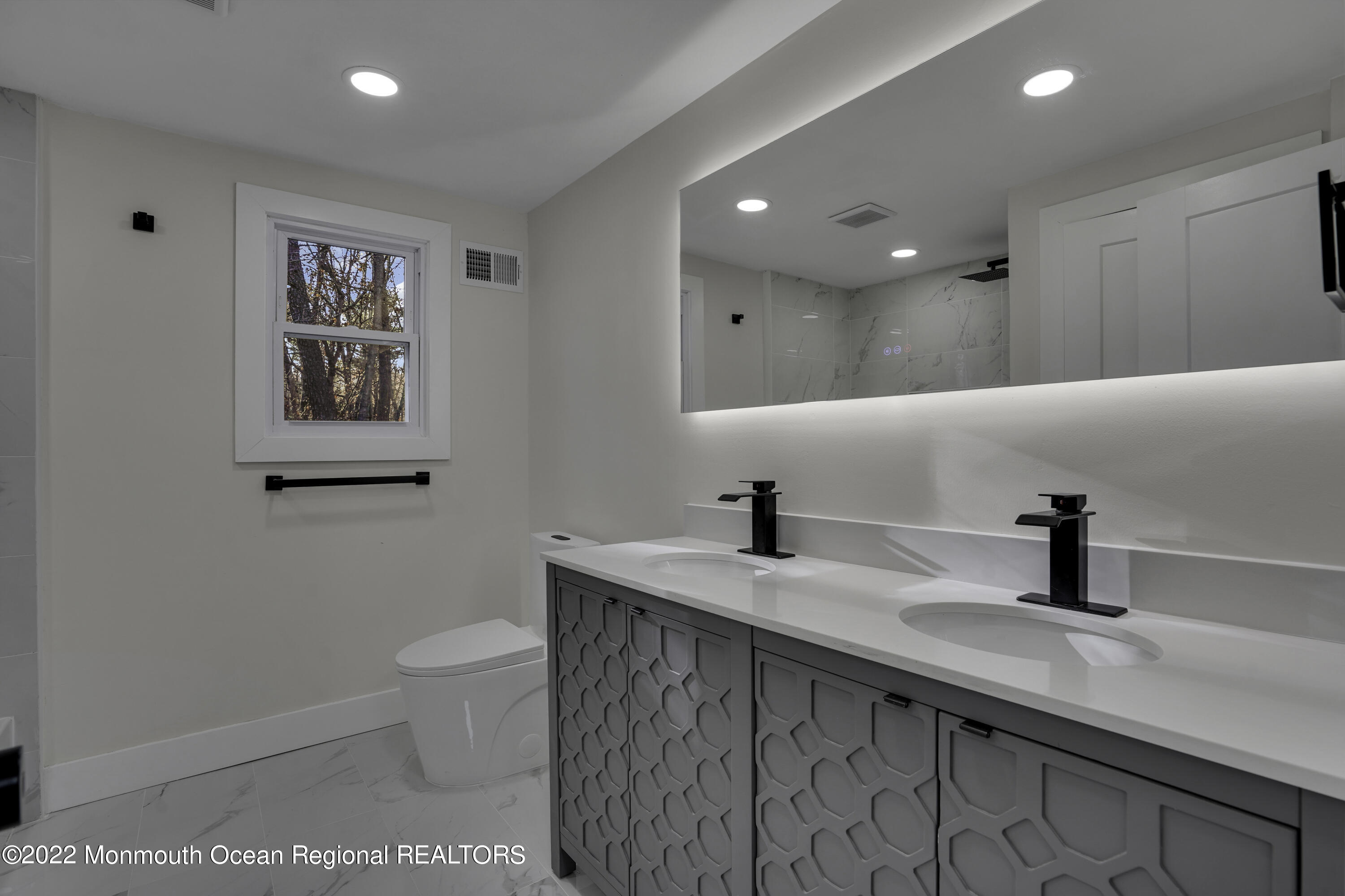 614 Jackson Mills Road Jackson, NJ 08527 - Photo 28 of 64 a kitchen with stainless steel appliances a sink and a refrigerator