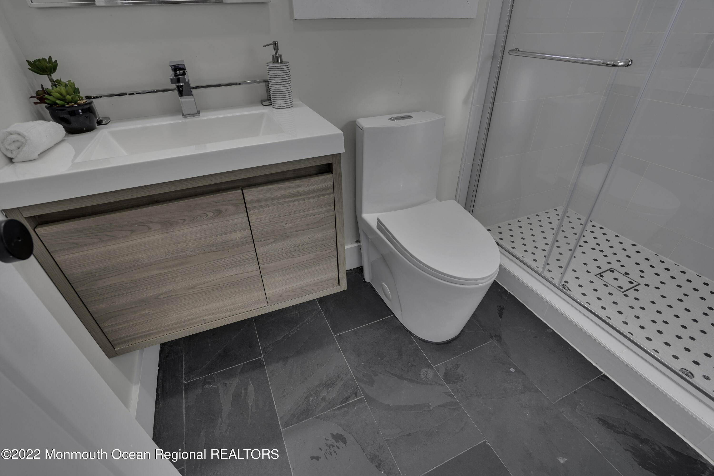 614 Jackson Mills Road Jackson, NJ 08527 - Photo 33 of 64 a bathroom with a sink a toilet and mirror