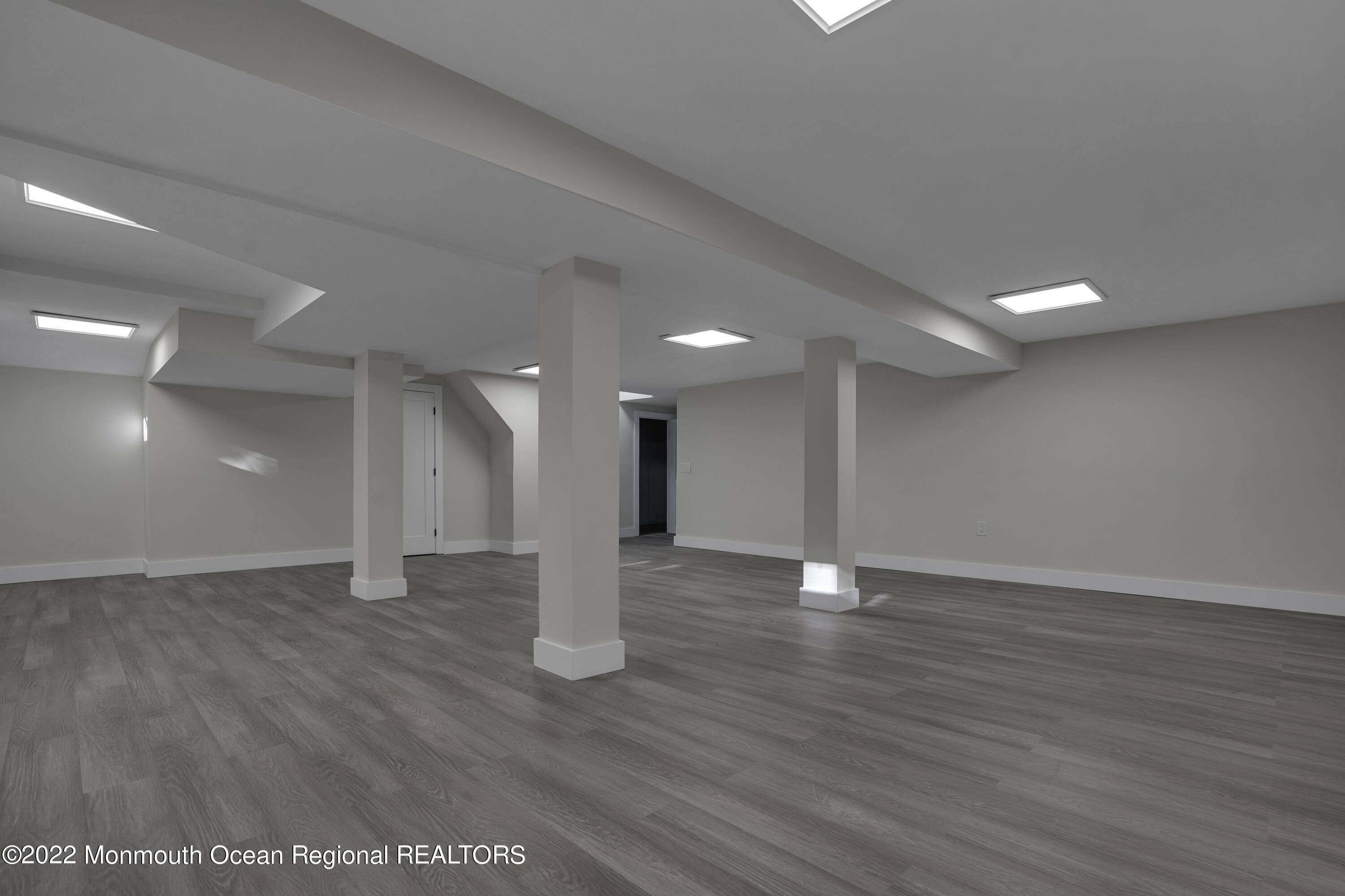 614 Jackson Mills Road Jackson, NJ 08527 - Photo 40 of 64 a view of an empty room with wooden floor