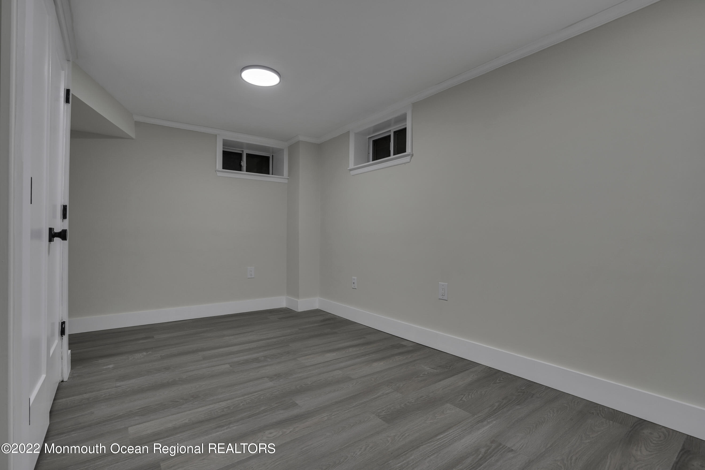 614 Jackson Mills Road Jackson, NJ 08527 - Photo 41 of 64 a view of an empty room with wooden floor and a window