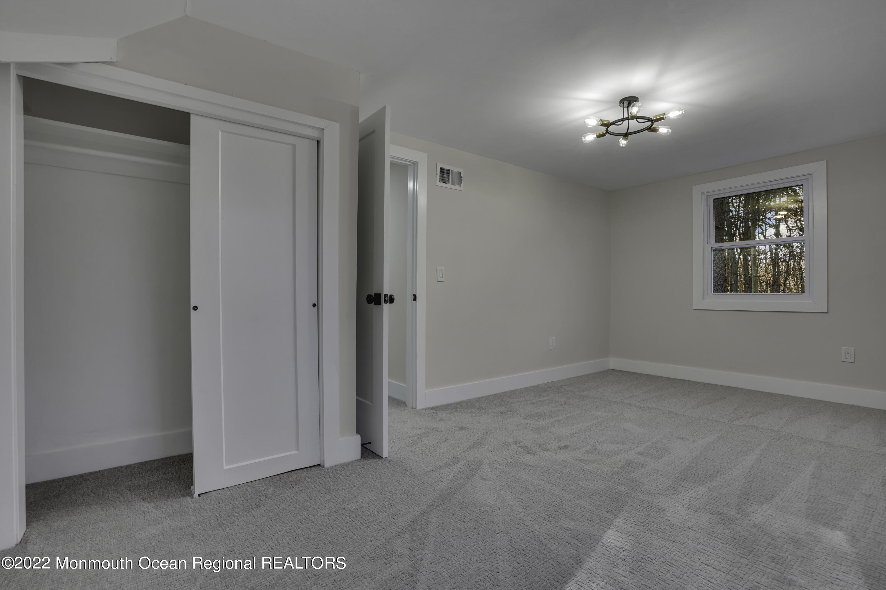 614 Jackson Mills Road Jackson, NJ 08527 - Photo 45 of 64 a view of an empty room with a fan