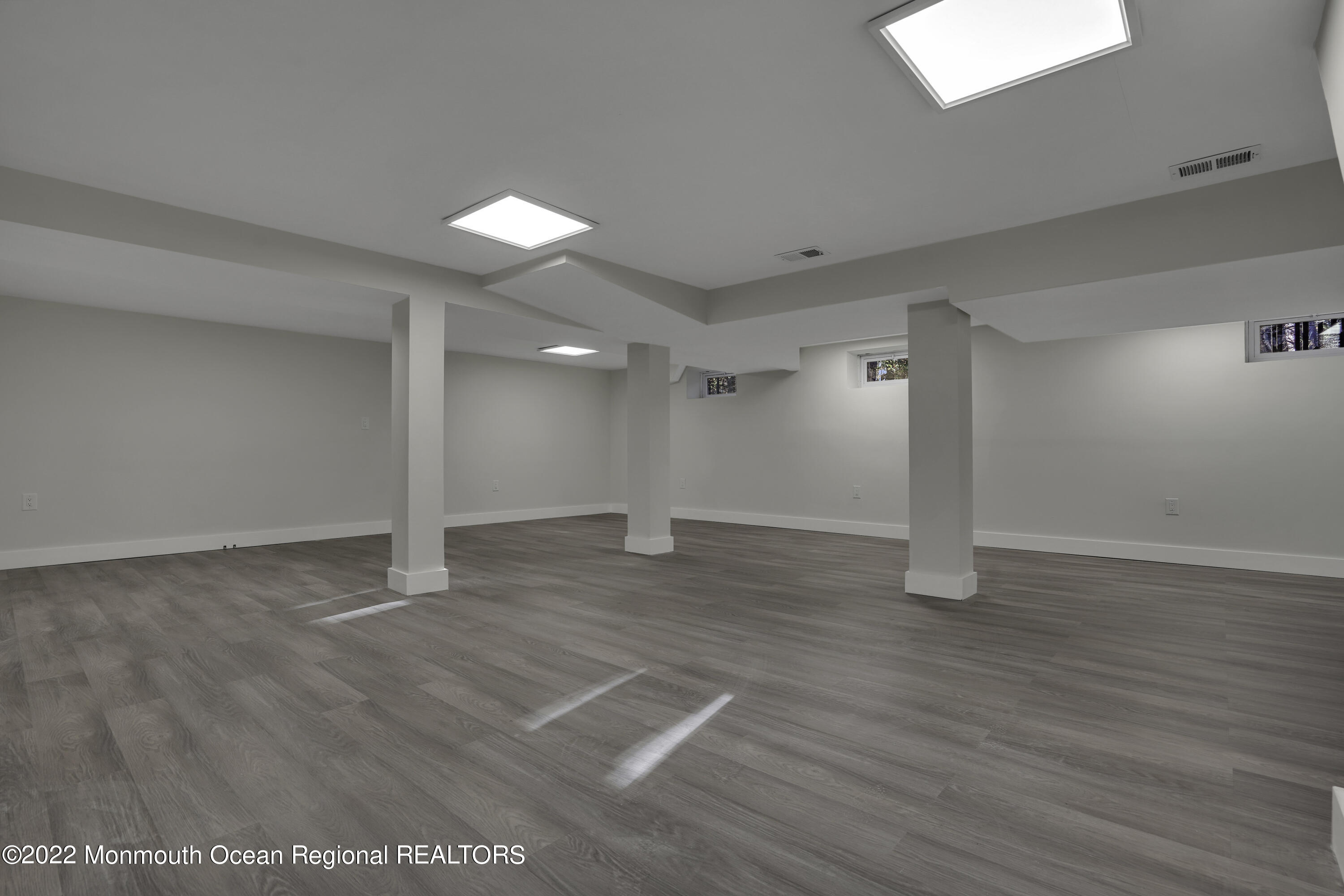 614 Jackson Mills Road Jackson, NJ 08527 - Photo 46 of 64 a view of an empty room with wooden floor and a window