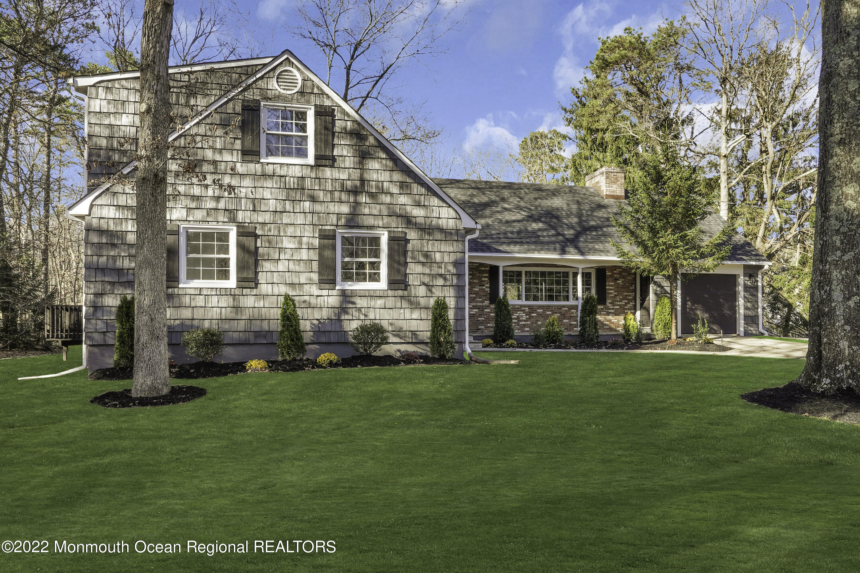 614 Jackson Mills Road Jackson, NJ 08527 - Photo 61 of 64 a front view of a house with a garden