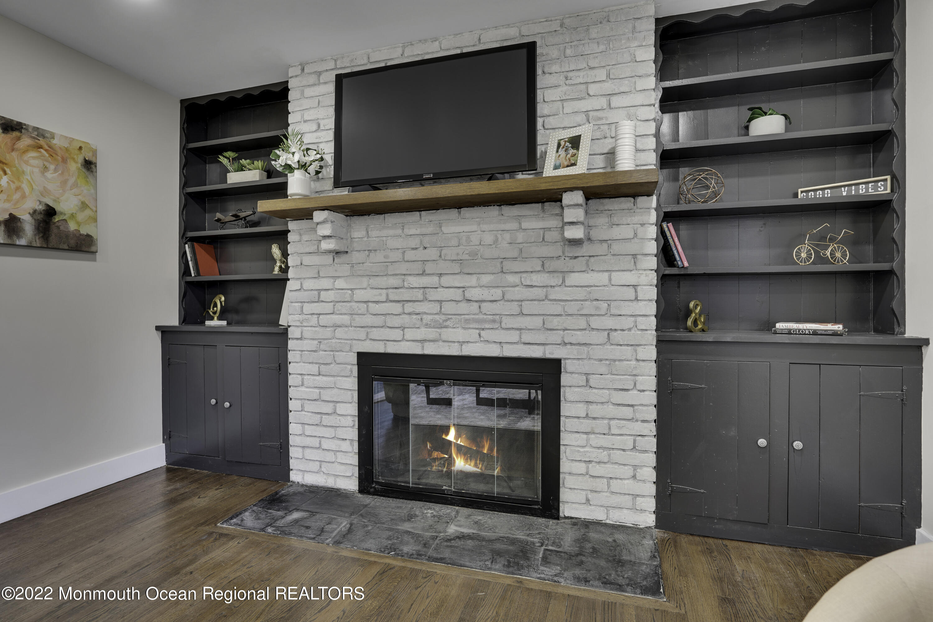 614 Jackson Mills Road Jackson, NJ 08527 - Photo 8 of 64 a living room with a fireplace and a flat screen tv