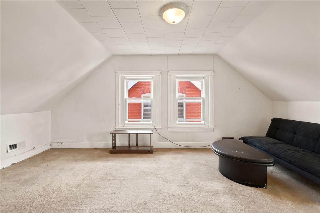 803 Spring Street Bethlehem, PA 18018 - Photo 28 of 34 An inviting attic retreat offers flexible living space and bright window views.