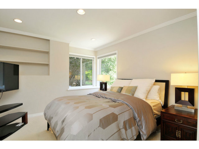 6 Spring Valley Lane Millbrae, CA 94030 - Photo 14 of 25 a bedroom with a bed and a flat screen tv