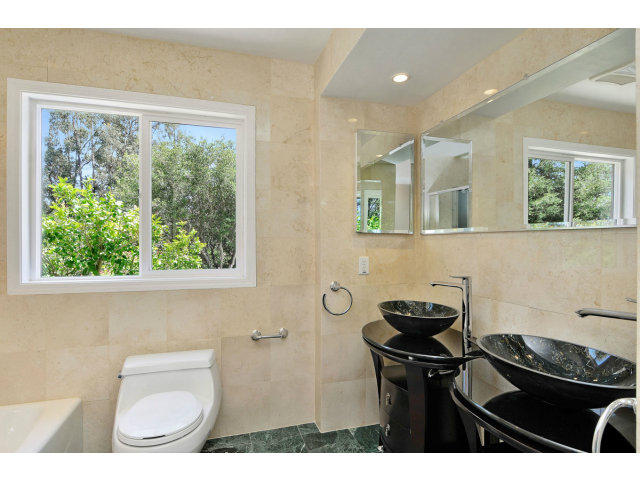 6 Spring Valley Lane Millbrae, CA 94030 - Photo 18 of 25 a bathroom with a sink a toilet and a window
