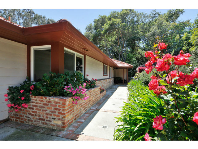6 Spring Valley Lane Millbrae, CA 94030 - Photo 2 of 25 a house view with a lot of flower plants