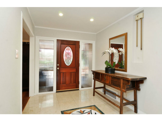 6 Spring Valley Lane Millbrae, CA 94030 - Photo 3 of 25 a view of a hallway with wooden floor and windows