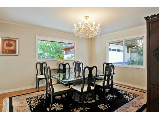 6 Spring Valley Lane Millbrae, CA 94030 - Photo 6 of 25 a view of a dining room with furniture a chandelier and wooden floor