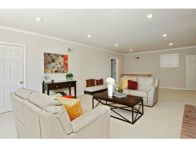 6 Spring Valley Lane Millbrae, CA 94030 - Photo 10 of 25 a living room with furniture and a flat screen tv