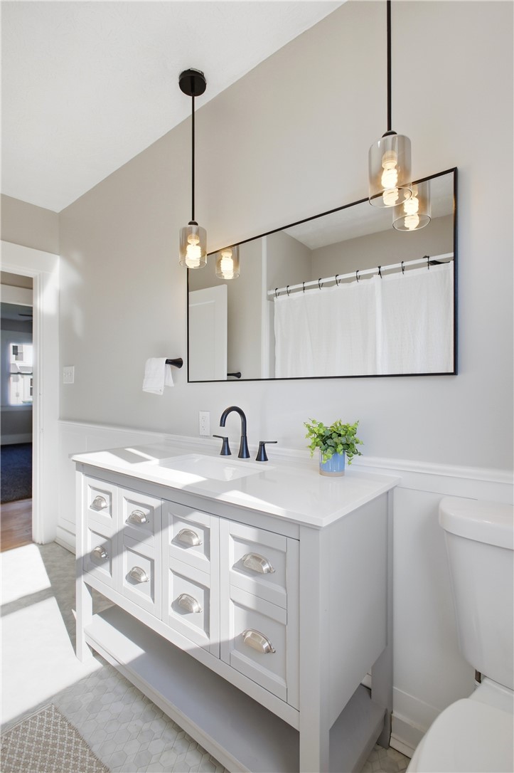 1925 Sunset Avenue Springfield, OH 45505 - Photo 25 of 45 This bright bathroom features a modern vanity with elegant pendant lighting and sleek fixtures.