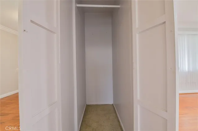 a view of a hallway with white door