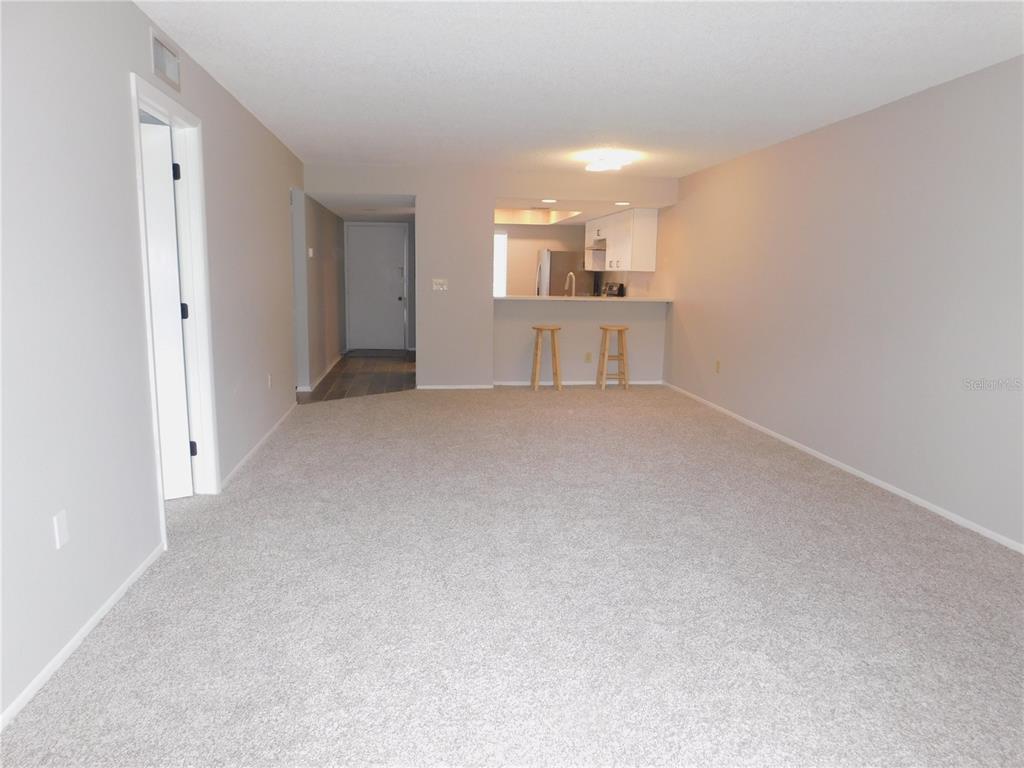 218 Caryl Way Oldsmar, FL 34677 - Photo 11 of 29 an empty room with windows and entrance