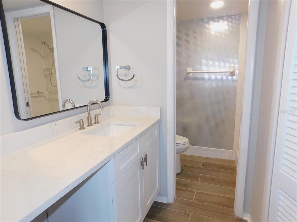 218 Caryl Way Oldsmar, FL 34677 - Photo 15 of 29 a bathroom with a granite countertop sink and a mirror