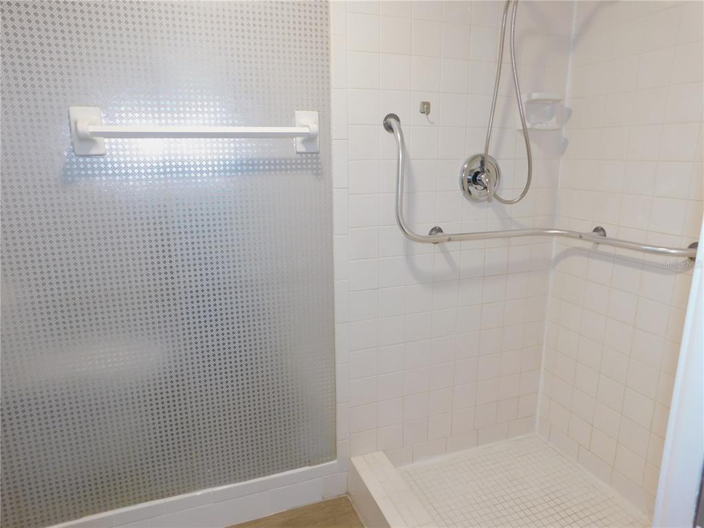 218 Caryl Way Oldsmar, FL 34677 - Photo 17 of 29 a bathroom with a glass shower door