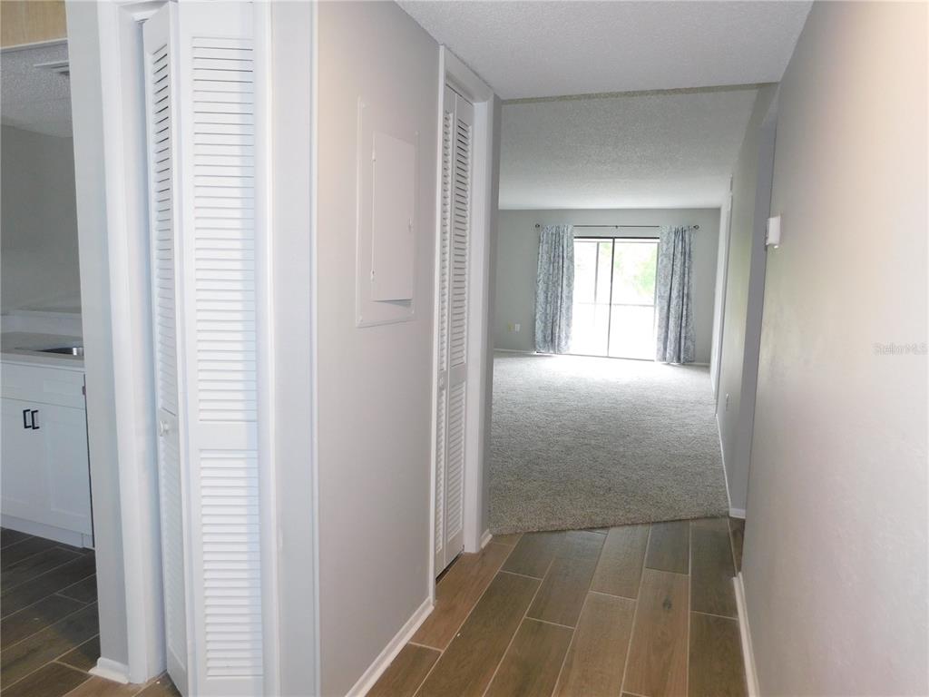 218 Caryl Way Oldsmar, FL 34677 - Photo 5 of 29 a view of a hallway with wooden floor and closet