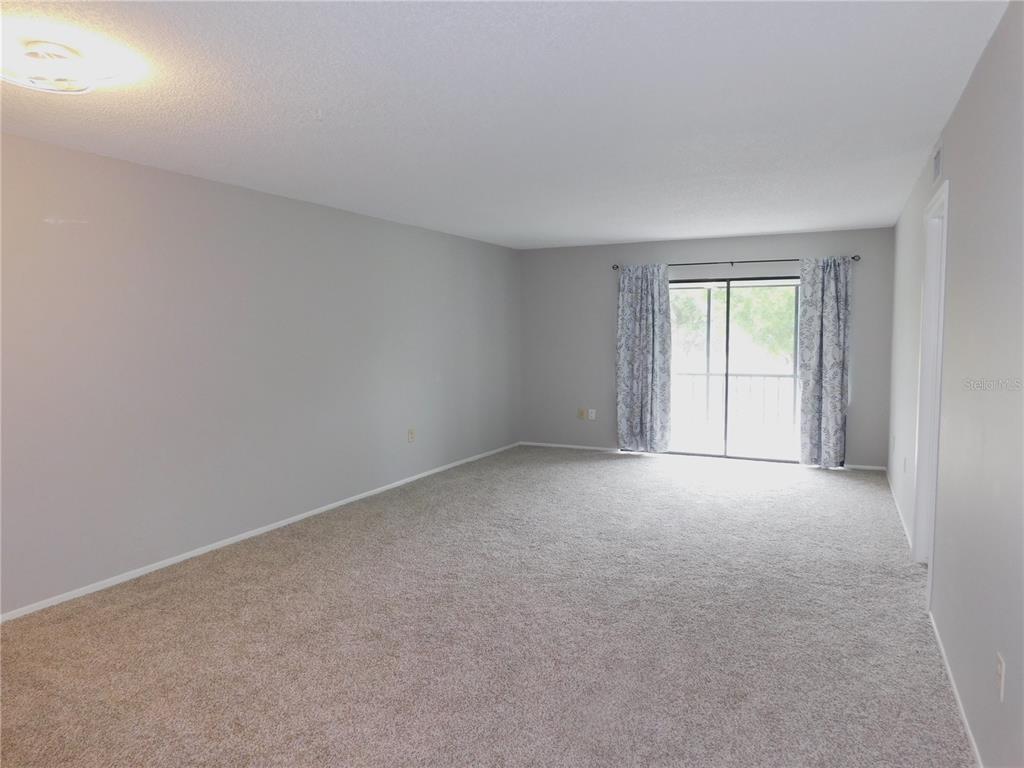 218 Caryl Way Oldsmar, FL 34677 - Photo 10 of 29 an empty room with windows